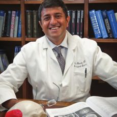 Photo of Dr. Ilyas Munshi, M. D. in his office