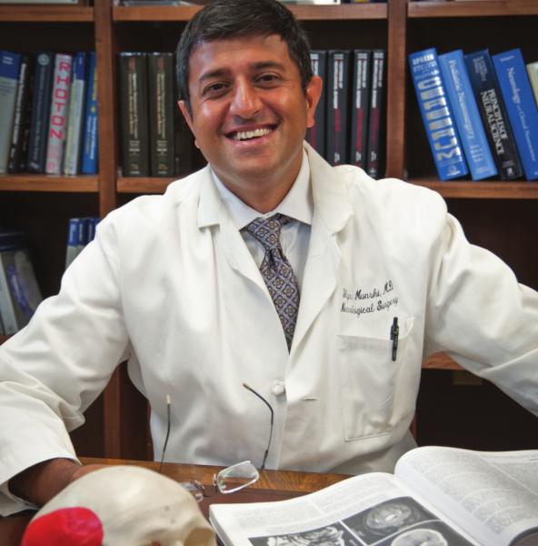 Photo of Dr. Ilyas Munshi, M. D. in his office