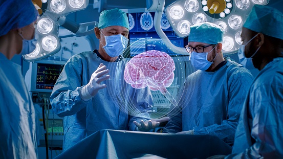 Photo of Surgeons Perform Brain Surgery Using Augmented Reality, Animated 3D Brain. High Tech Technologically Advanced Hospital